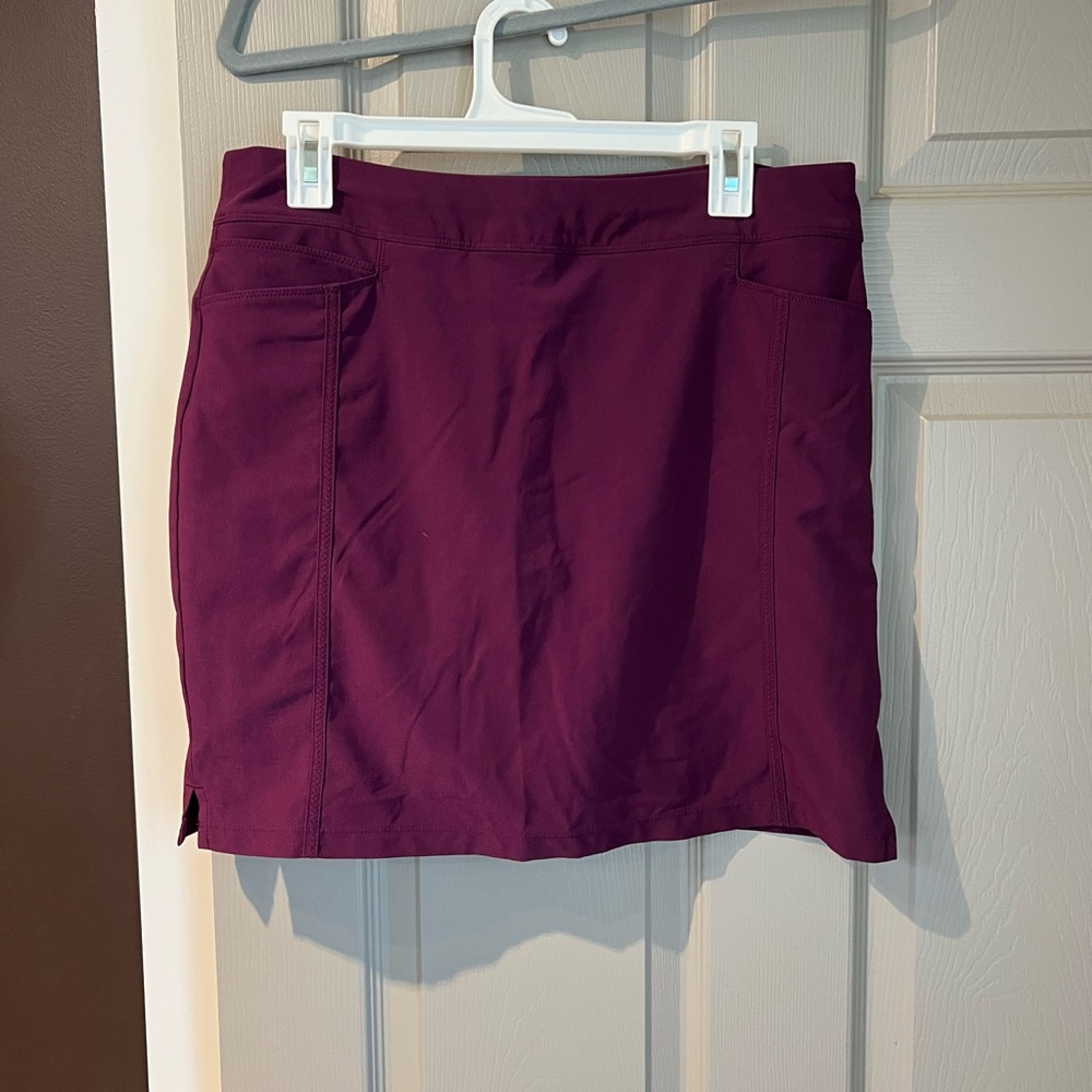 Adidas golf skort. Built in shorts. Pockets in front and back. Size M. Like new.